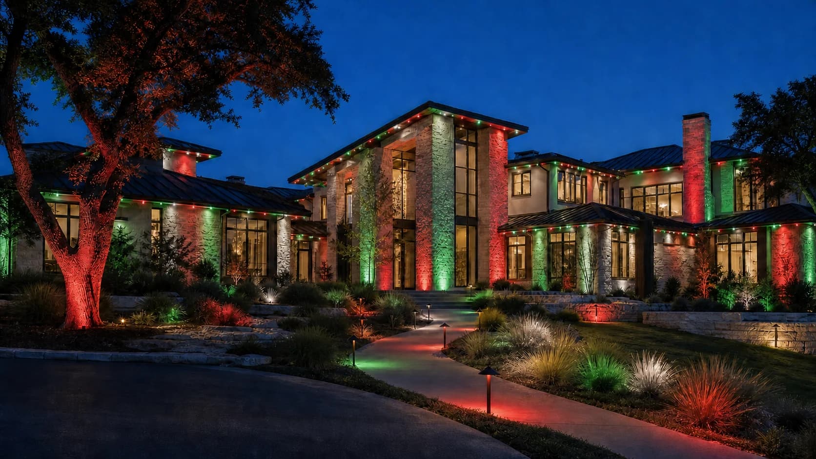 Fictional luxury home with synchronized red, green, and white landscape and roofline lighting