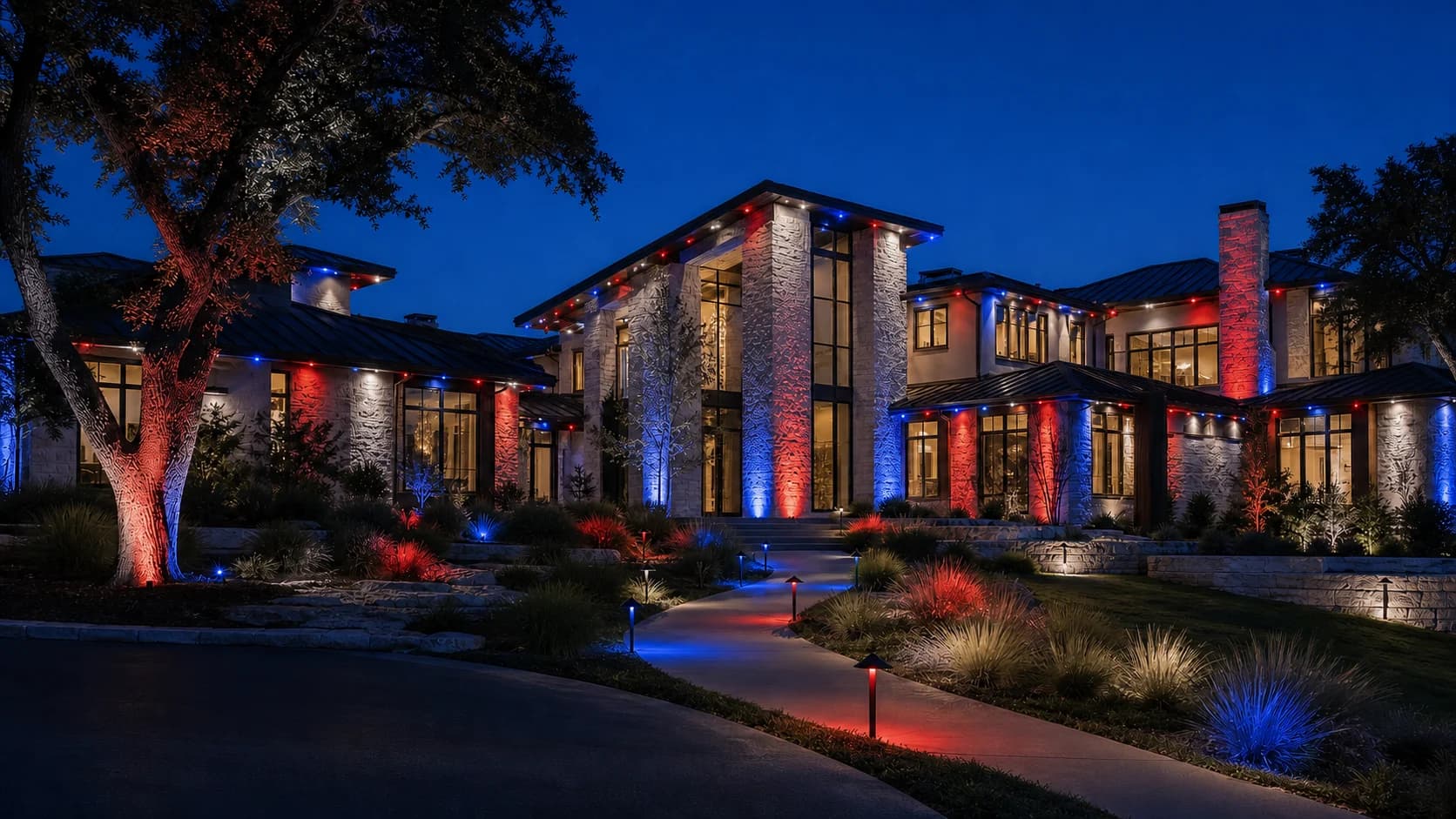 Fictional luxury home with synchronized red, white, and blue landscape and roofline lighting