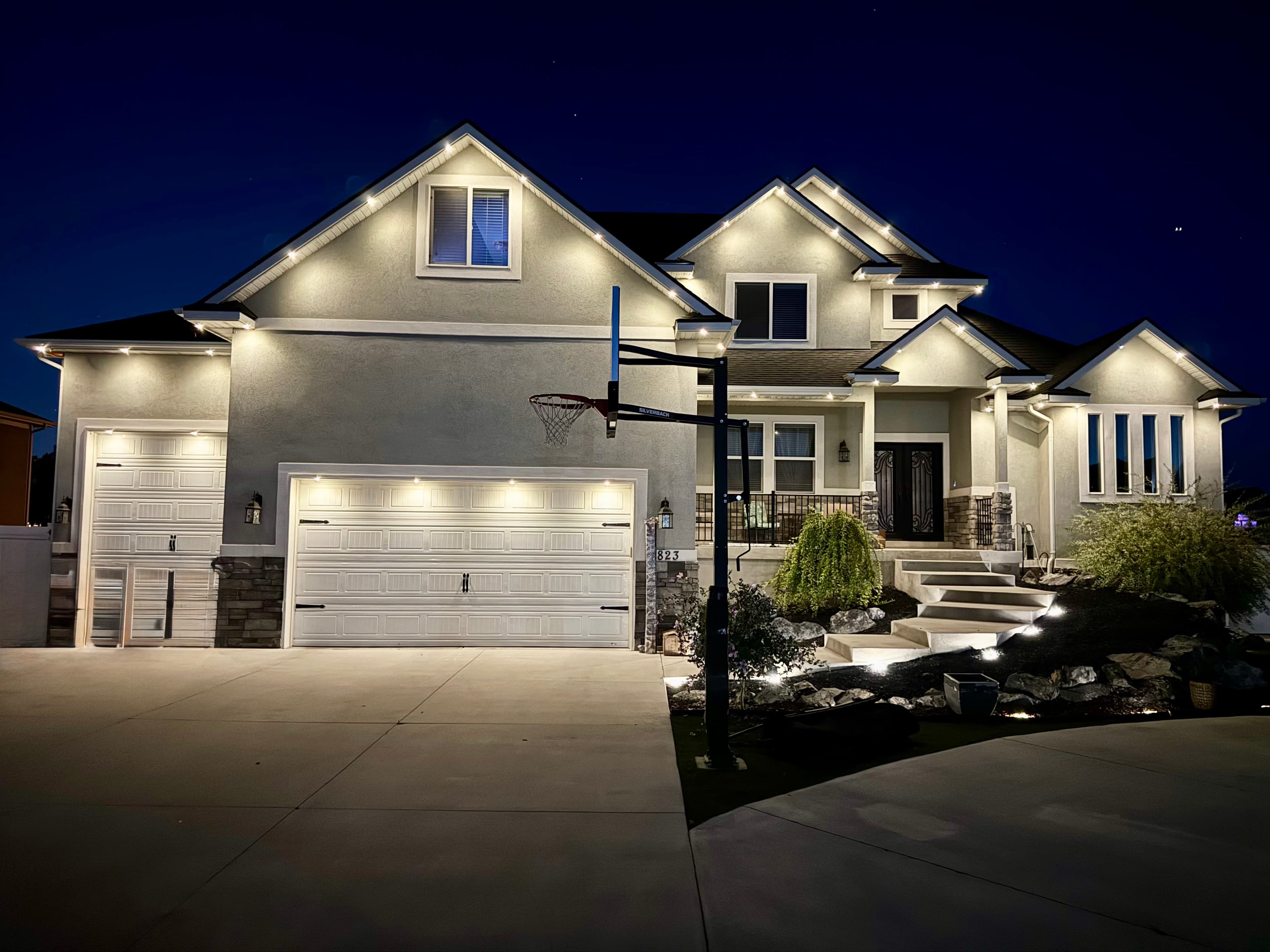 Outdoor LED lighting installation on a home (TruLight network install)